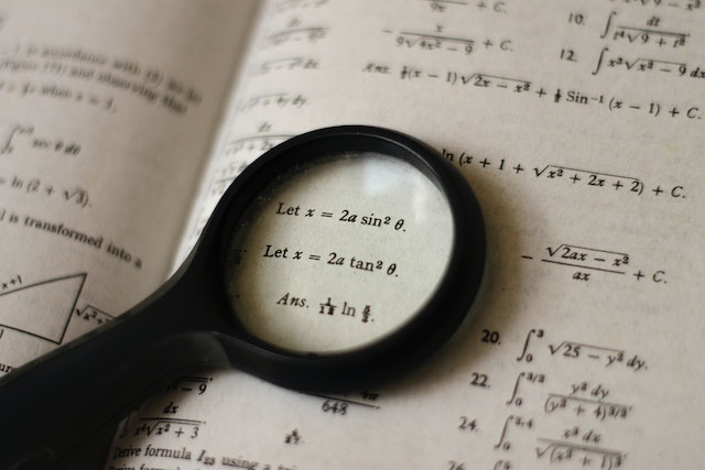 magnifying glass on math equations