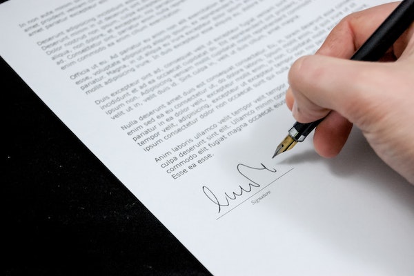 person signing letter